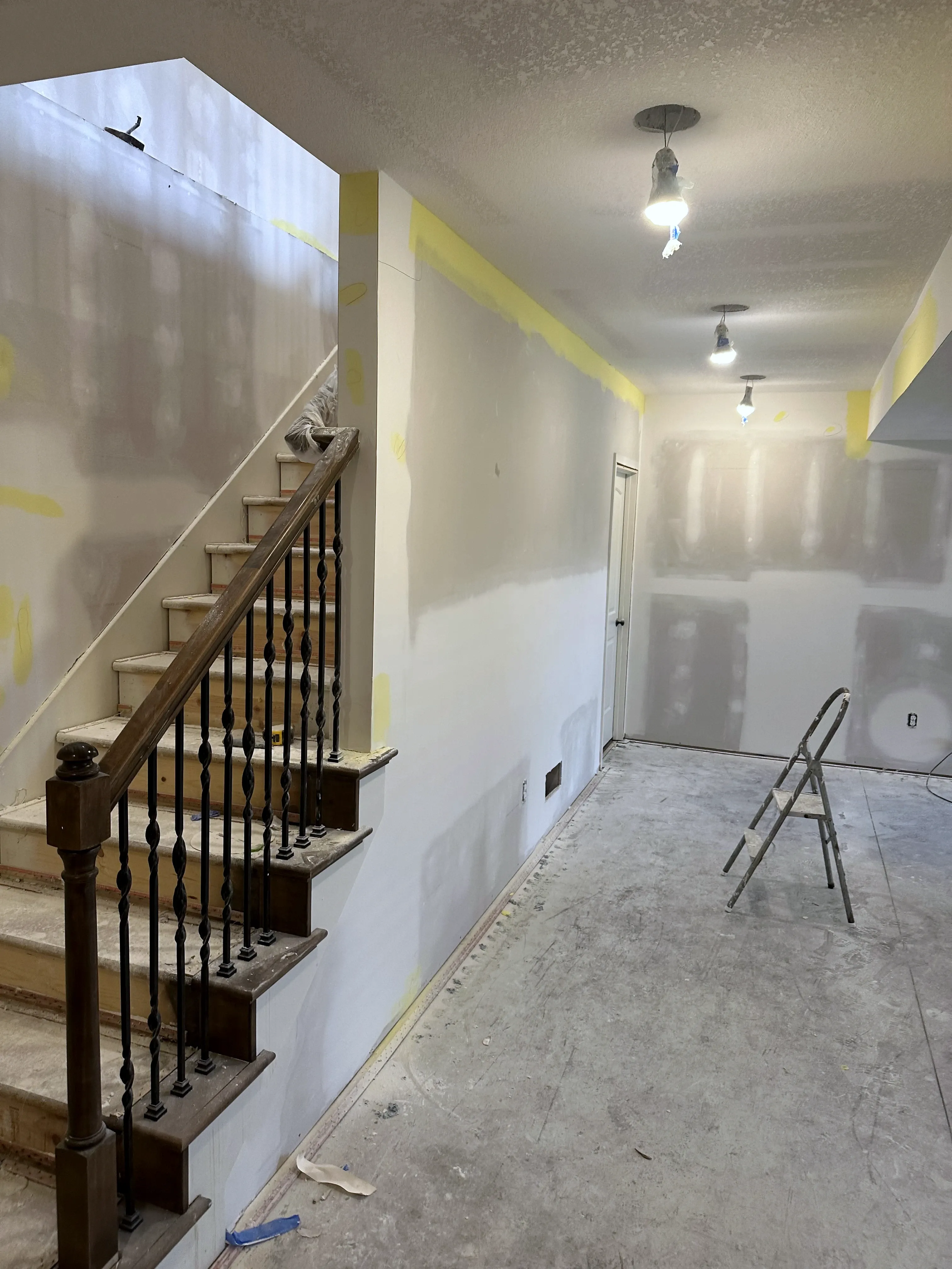 New sheetrock hung and taped in the lower level in a Holden, Missouri whole home remodel