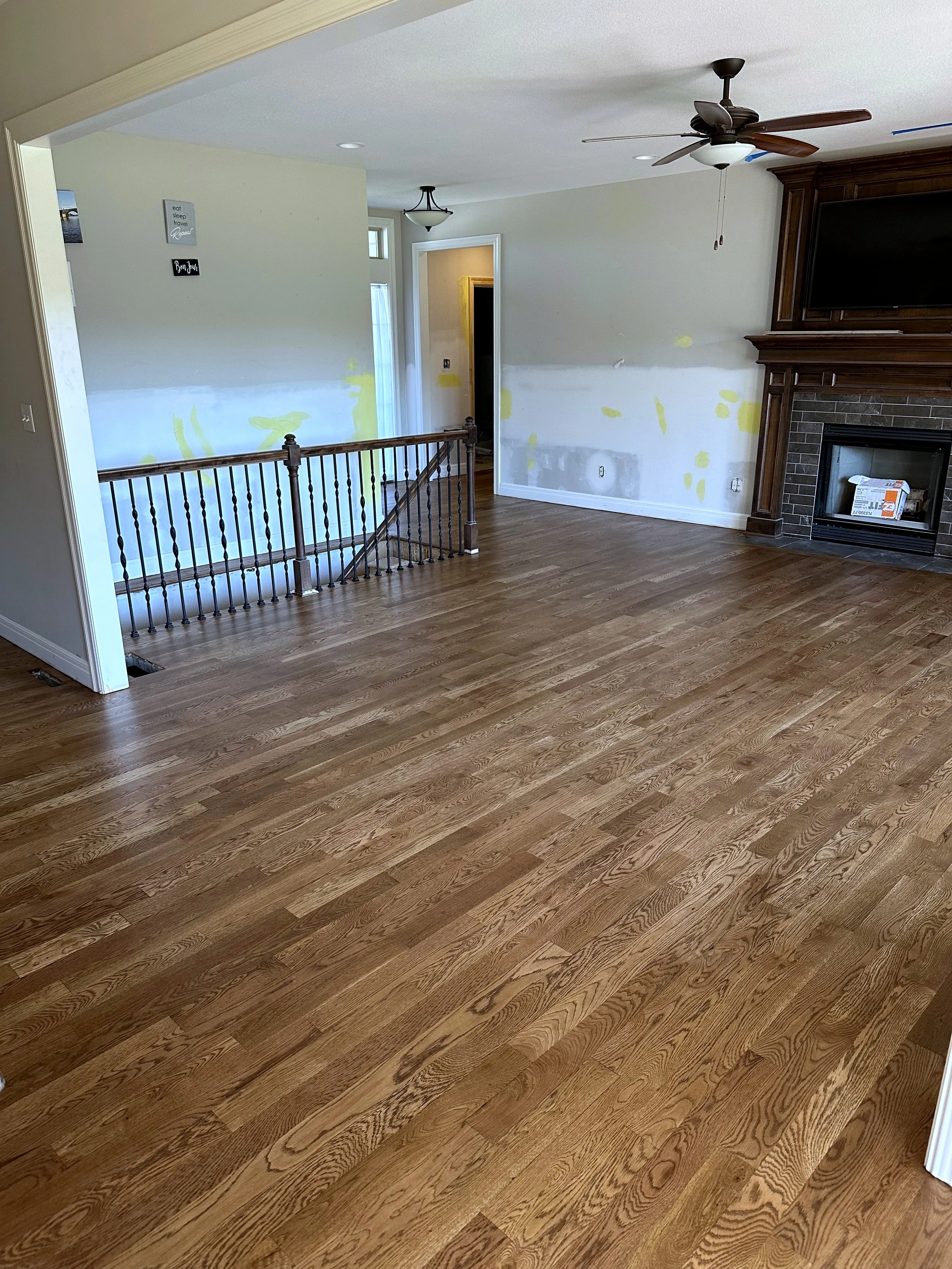 New hardwood floors installed through the main level, walls prepped for paint, in a Holden, Missouri whole home remodel