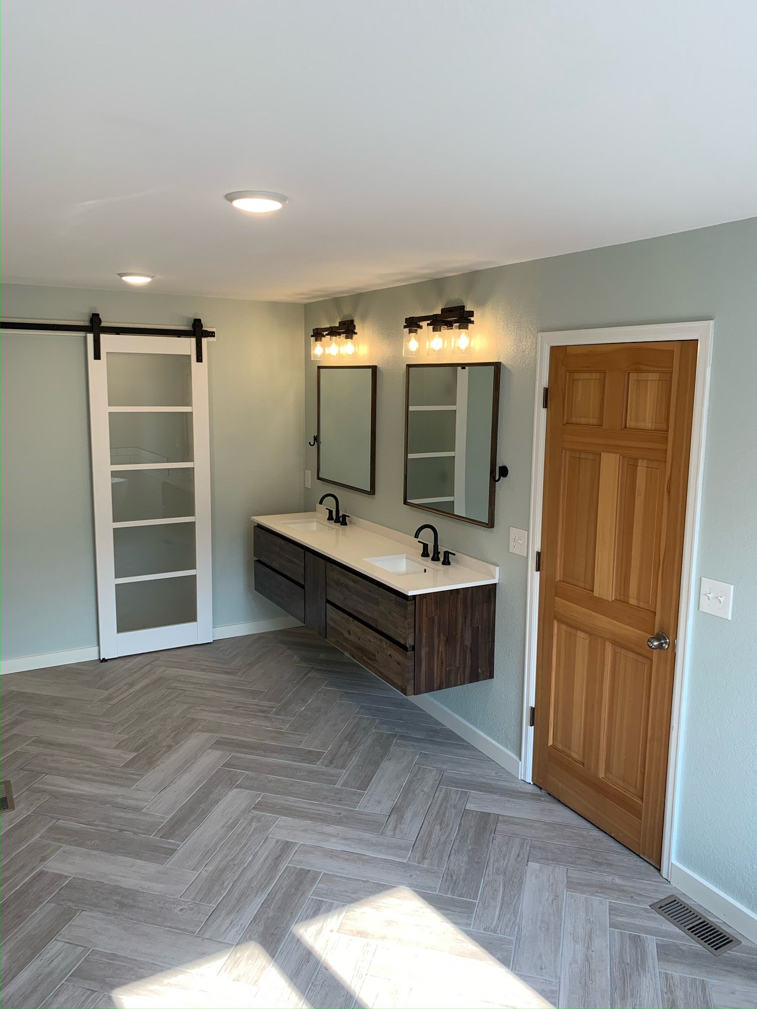 Finished bathroom remodel in a Leawood home by Resurrection Homes.