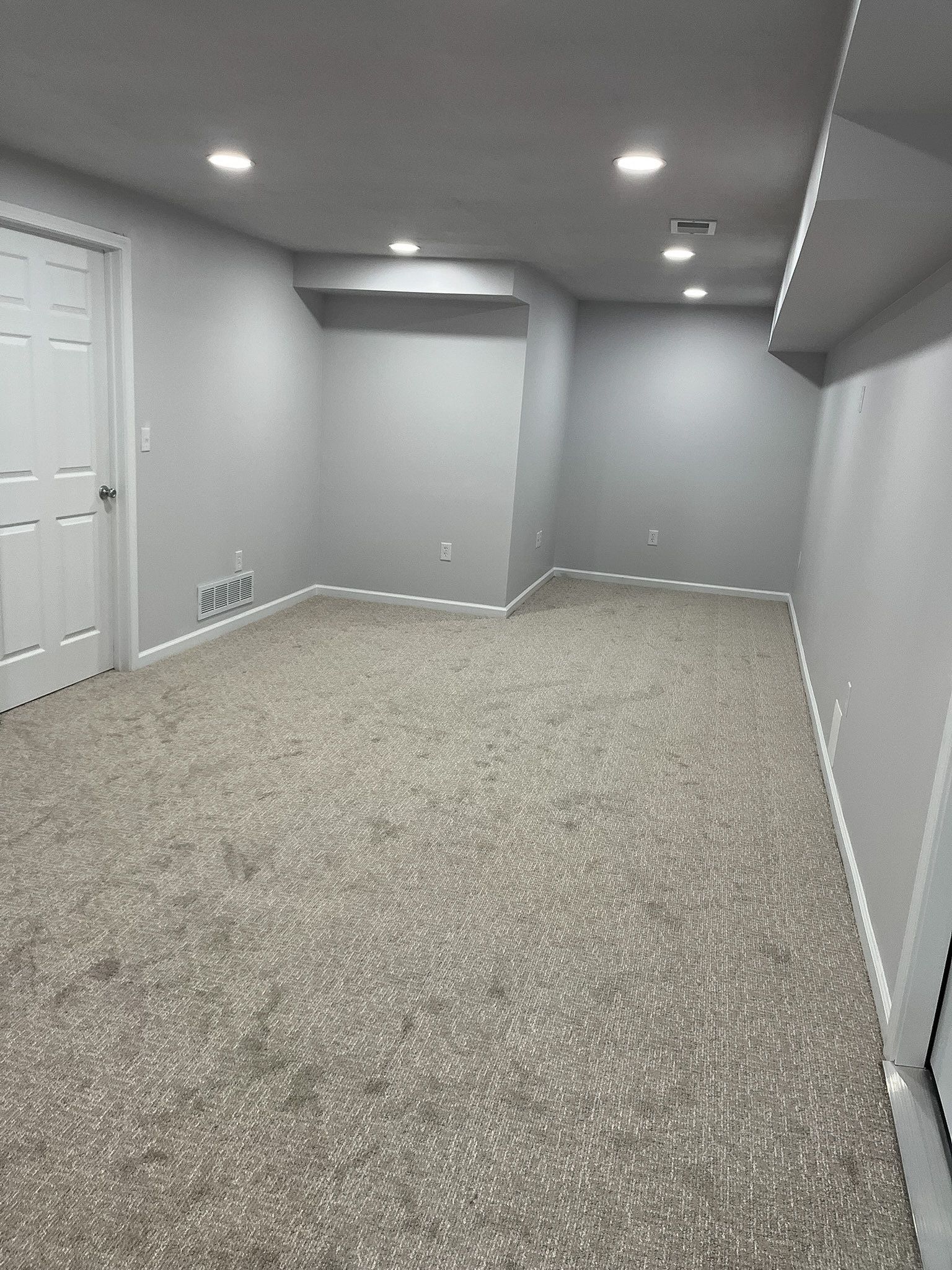 Finished basement remodel with living space in a Raymore home by Resurrection Homes.