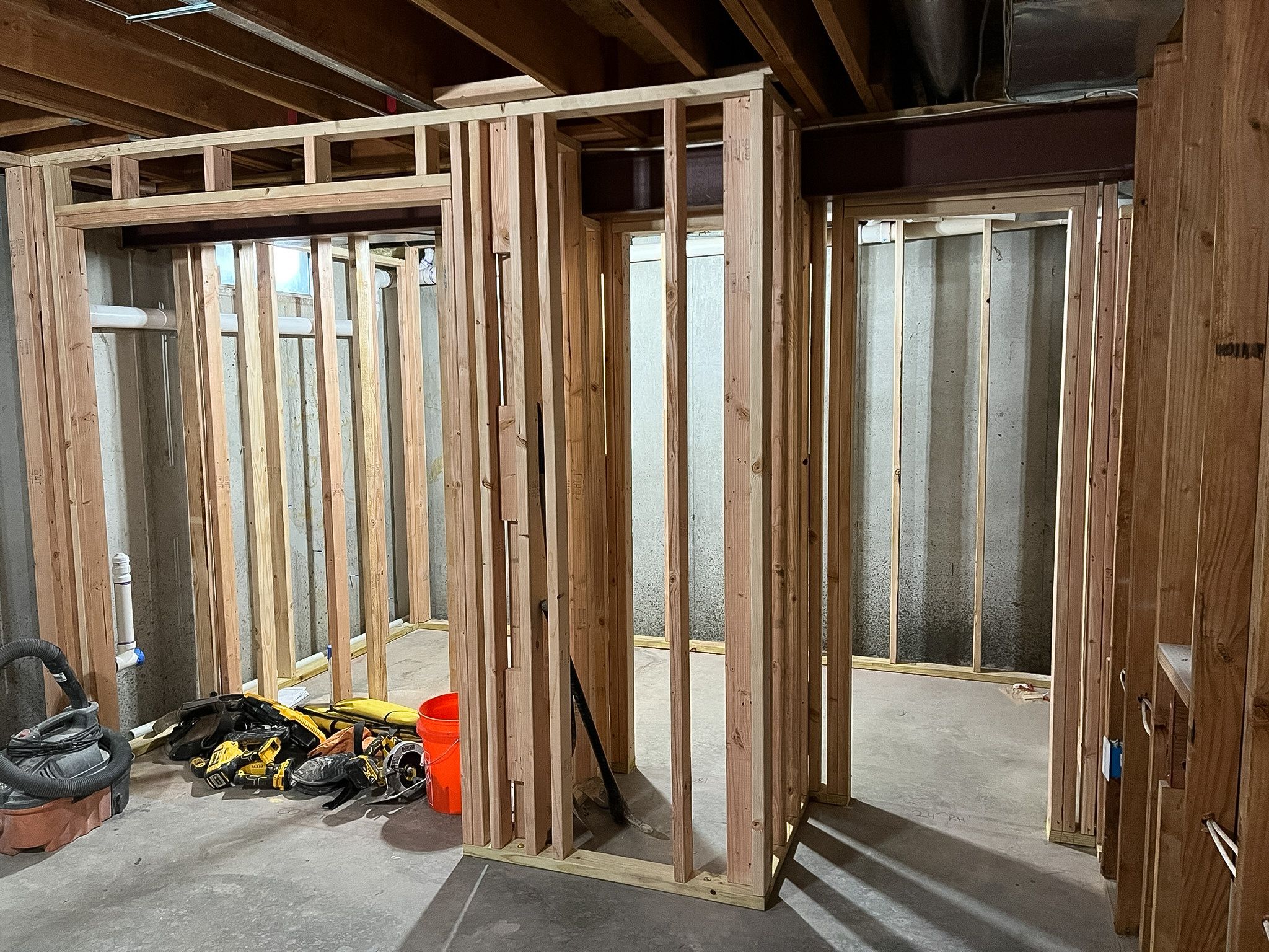 Framing a basement into rooms during a Raymore basement remodel by Resurrection Homes.