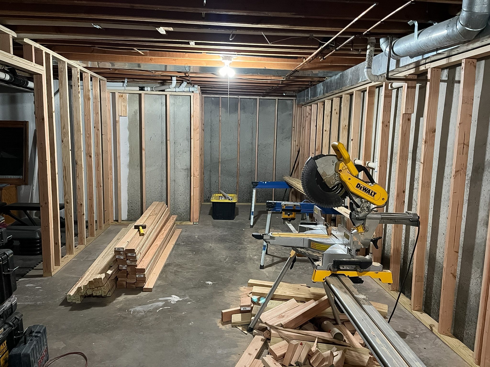 New room framing taking shape in a Raymore basement remodel.