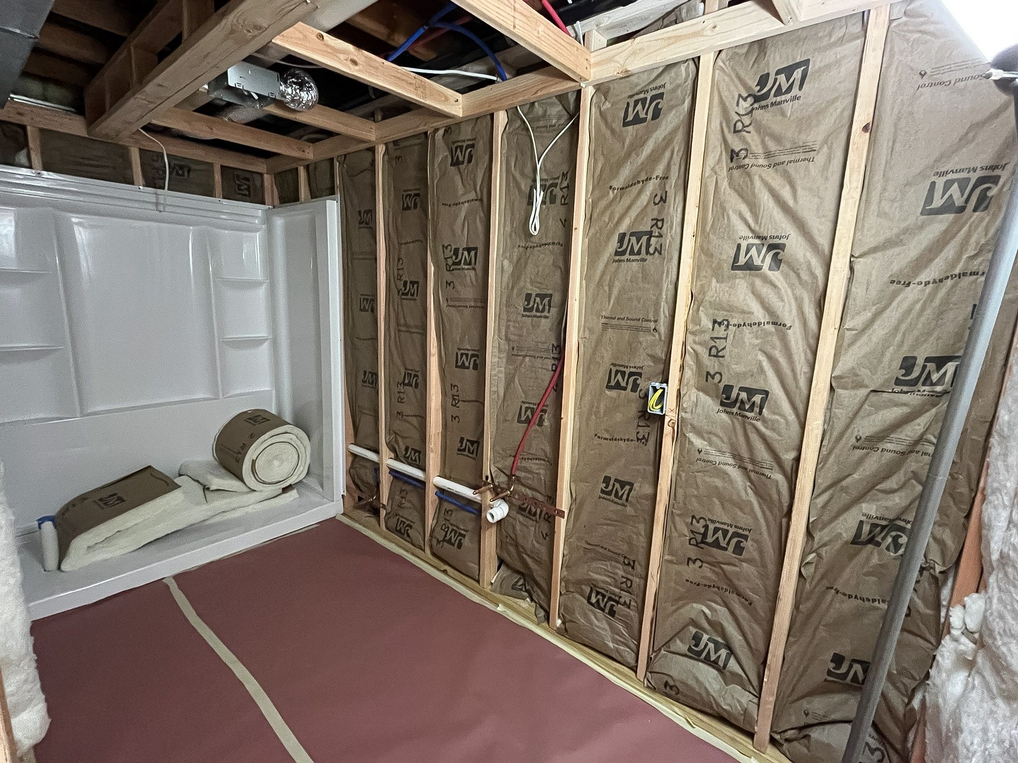 Insulation installed in a Raymore basement remodel by Resurrection Homes.