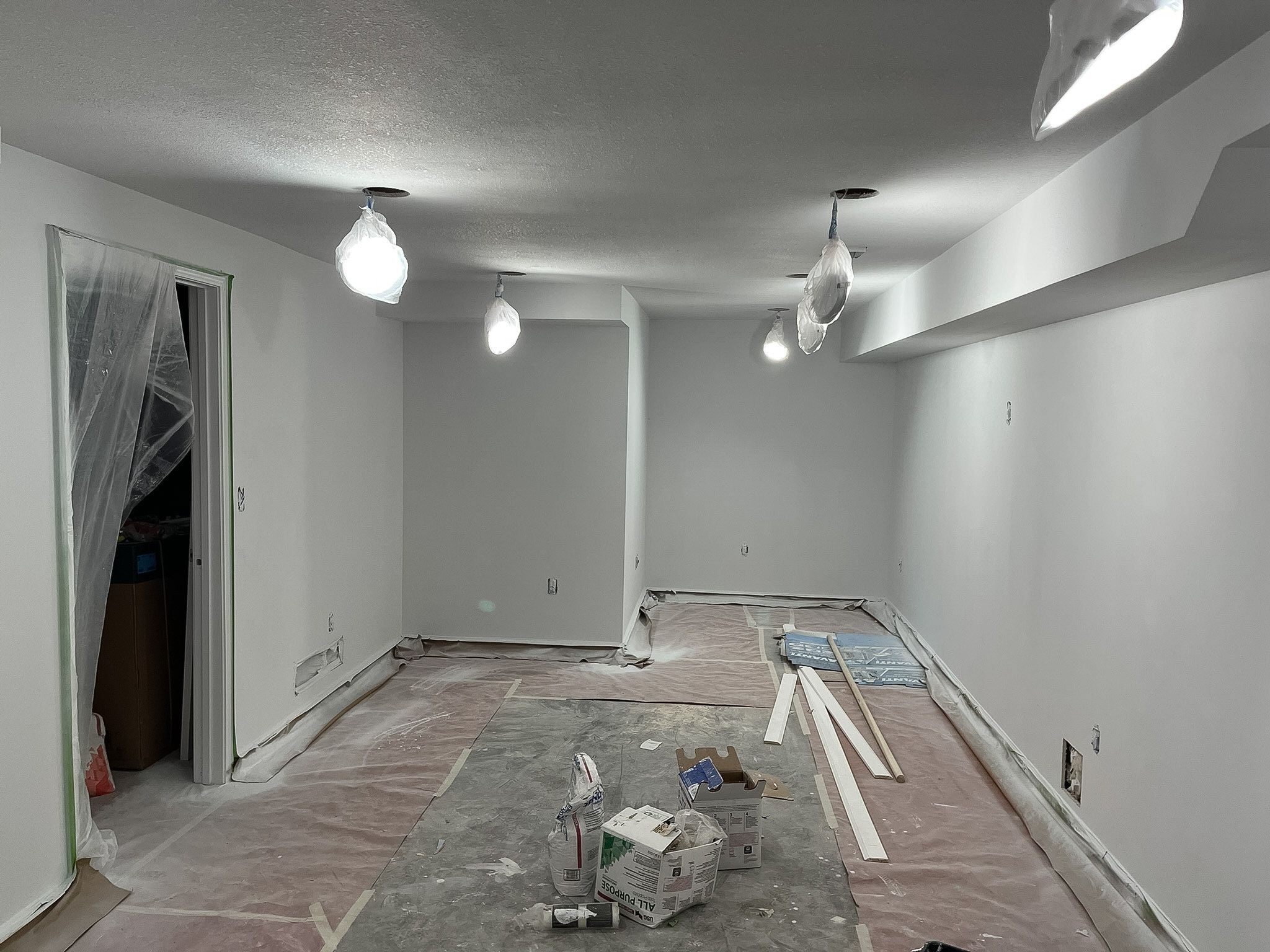 Recessed lighting installed in a Raymore basement remodel by Resurrection Homes.