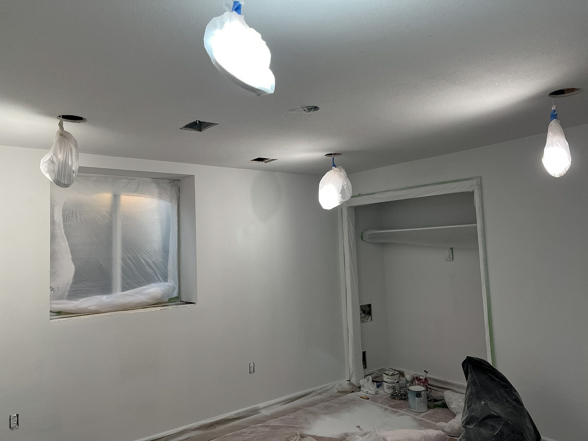 Layered lighting bringing a Raymore basement remodel to life.